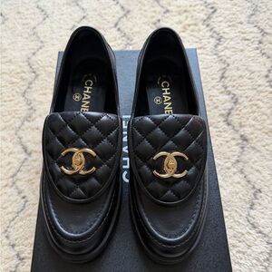 CHANEL Black and Gold Quilted Loafers